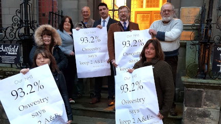 Oswestry Councillors holder posters stating that 93.2% of Oswestry says keep 2 A&Es